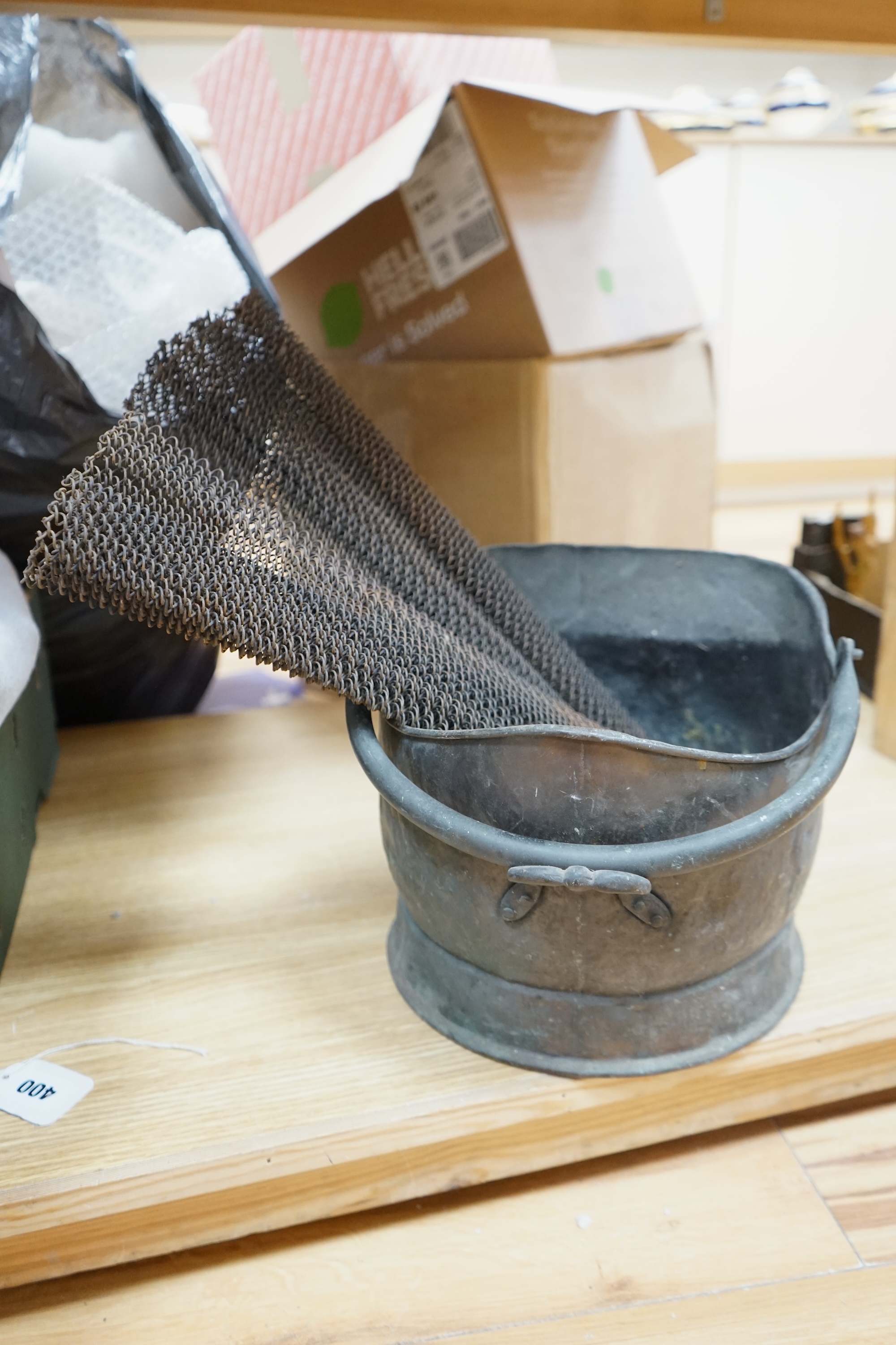 A copper coal scuttle and two American mesh fire screens, coal scuttle 32cm wide. Condition - fair